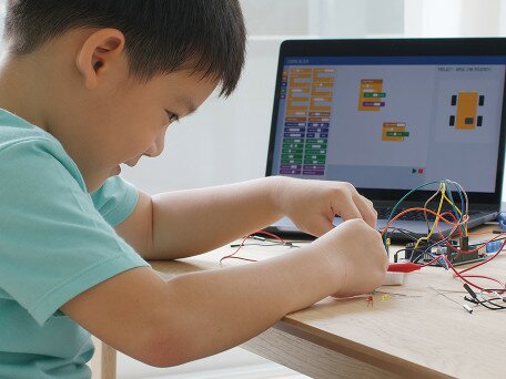 Robot Programming Through Play: Effects on Kindergarten Children’s Engagement and Computational Thinking
