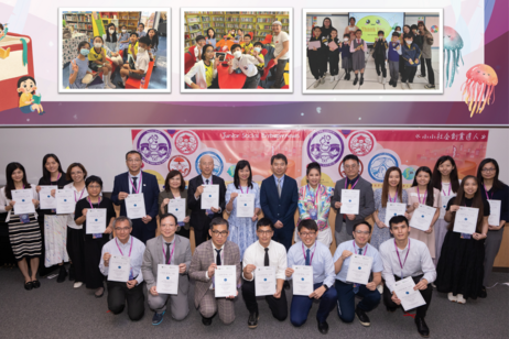 Prof Yan Zi, standing in the middle and serving as Head of the Department of Curriculum and Instruction, awards appointment letters to principal and teacher ambassadors from the six primary and secondary partner schools.