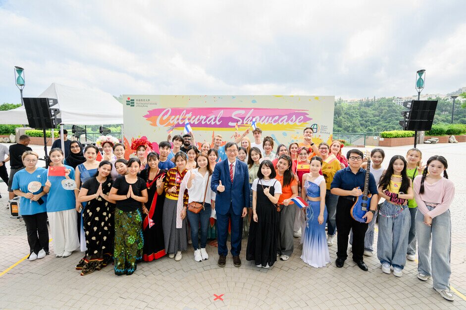 Group photo of the President, Cultural Showcase performers, booth runners and colleagues