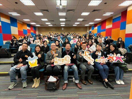 The speakers at the public lecture with the audience