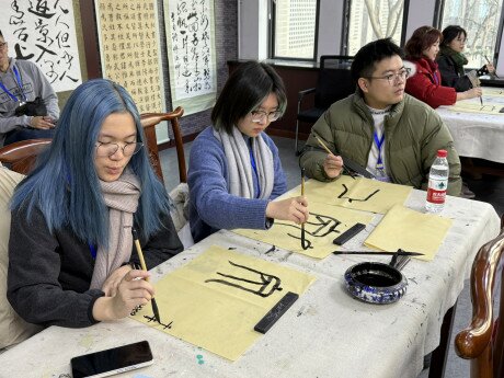 EdUHK students learning calligraphy at Chong Hua High School