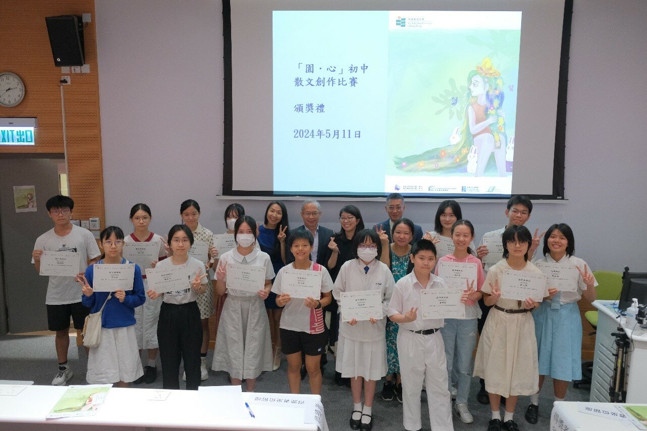 The winners take a group photo with the judges and award presenters